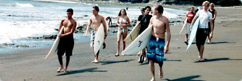 Surfers Walking Down the Beach