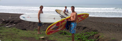 Guys Carrying Surfboards to Beach